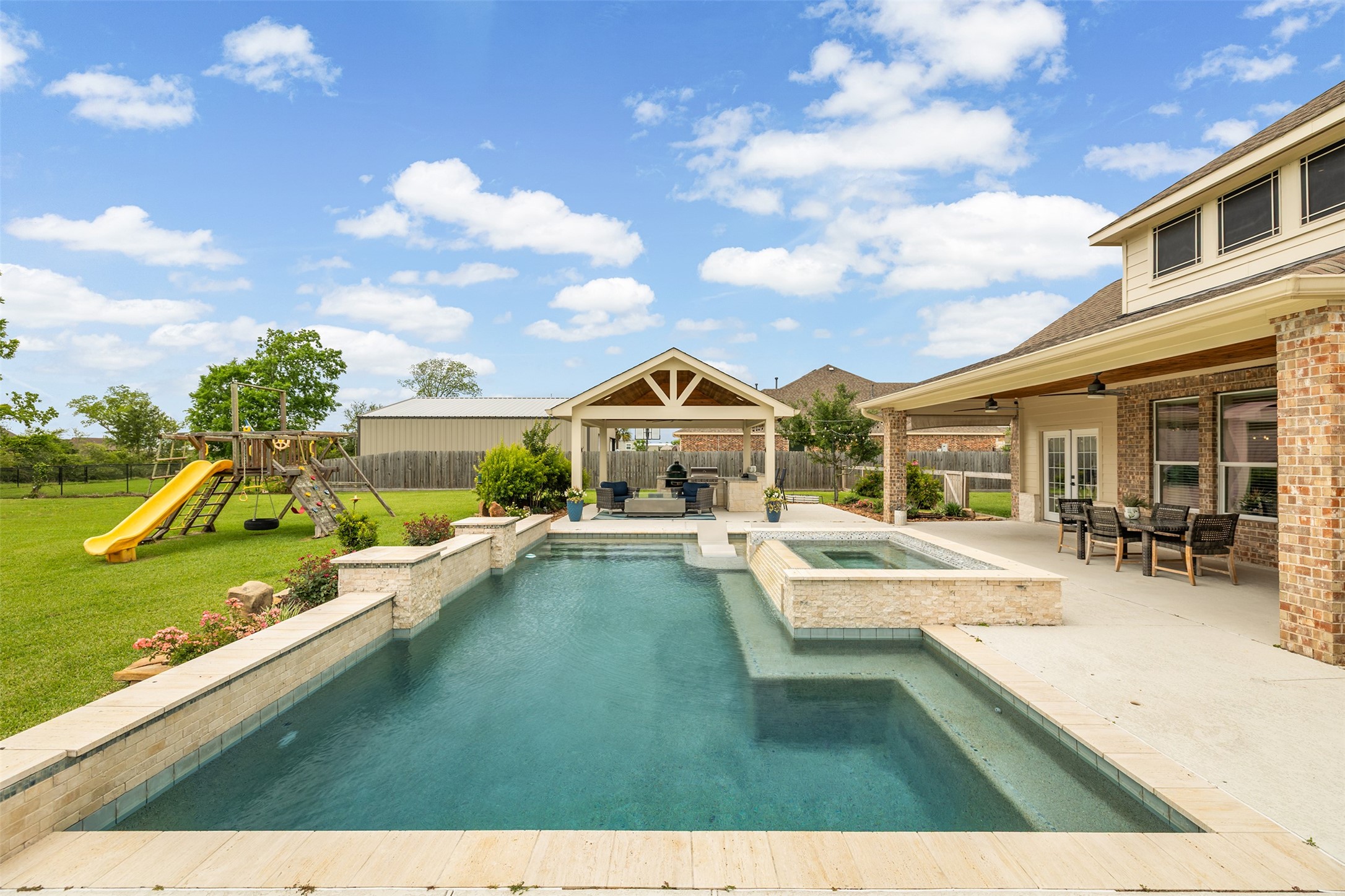 4502 Sunrise Road Baytown, TX 77523 - Photo 37 of 42 a view of a house with swimming pool and sitting area