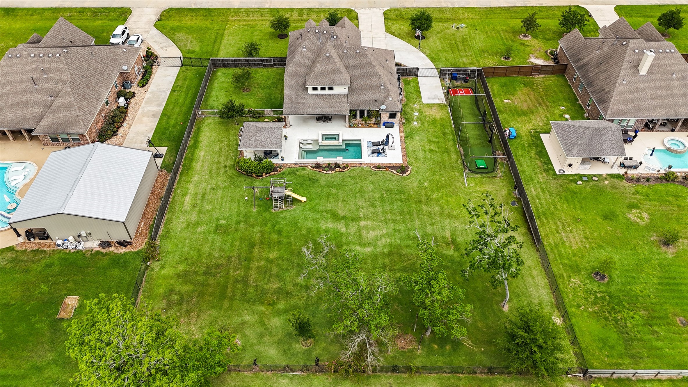 4502 Sunrise Road Baytown, TX 77523 - Photo 41 of 42 an aerial view of a house with a garden and swimming pool