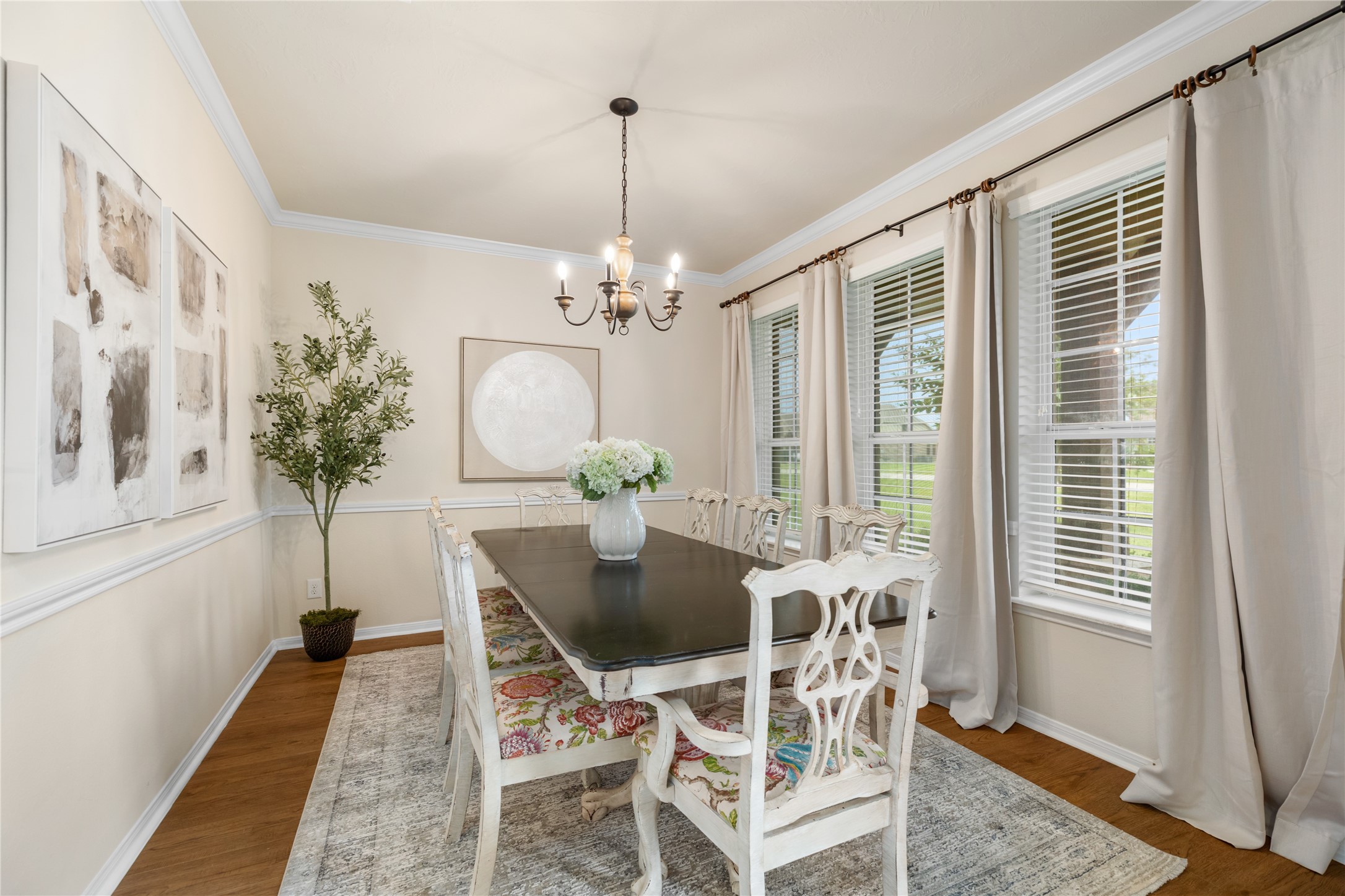 4502 Sunrise Road Baytown, TX 77523 - Photo 5 of 42 a view of a dining room with furniture and a chandelier