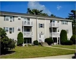 1619 Braley Road, Unit 98 New Bedford, MA 02745 - Photo 2 of 32 a front view of a house with a yard