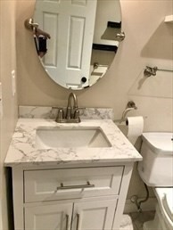 1619 Braley Road, Unit 98 New Bedford, MA 02745 - Photo 27 of 32 a bathroom with a sink and a mirror