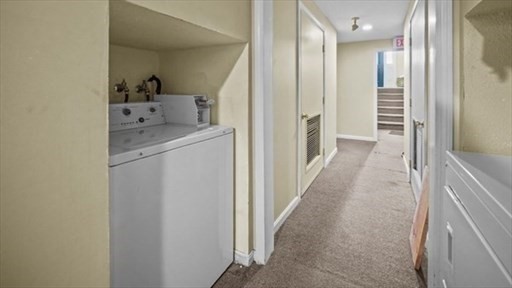 1619 Braley Road, Unit 98 New Bedford, MA 02745 - Photo 32 of 32 a view of a hallway with closet and utility room