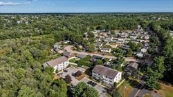 1619 Braley Road, Unit 98 New Bedford, MA 02745 - Photo 7 of 32 an aerial view of a house with a yard