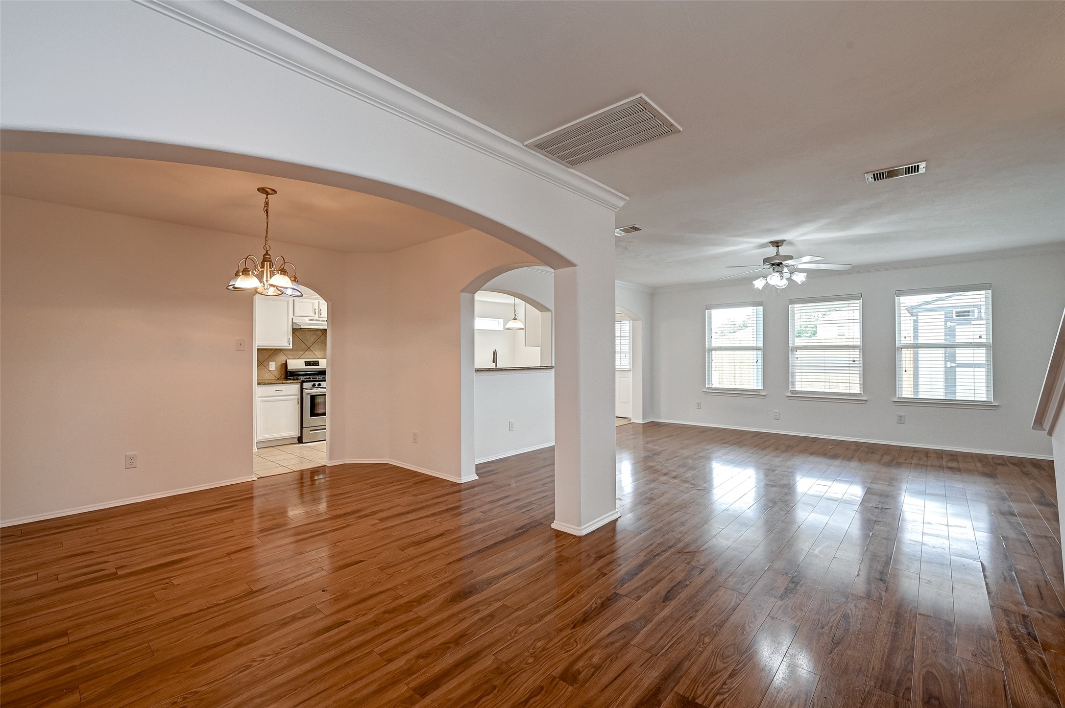 6906 Anson Point Lane Houston, TX 77040 - Photo 5 of 31 a view of empty room with wooden floor and fan