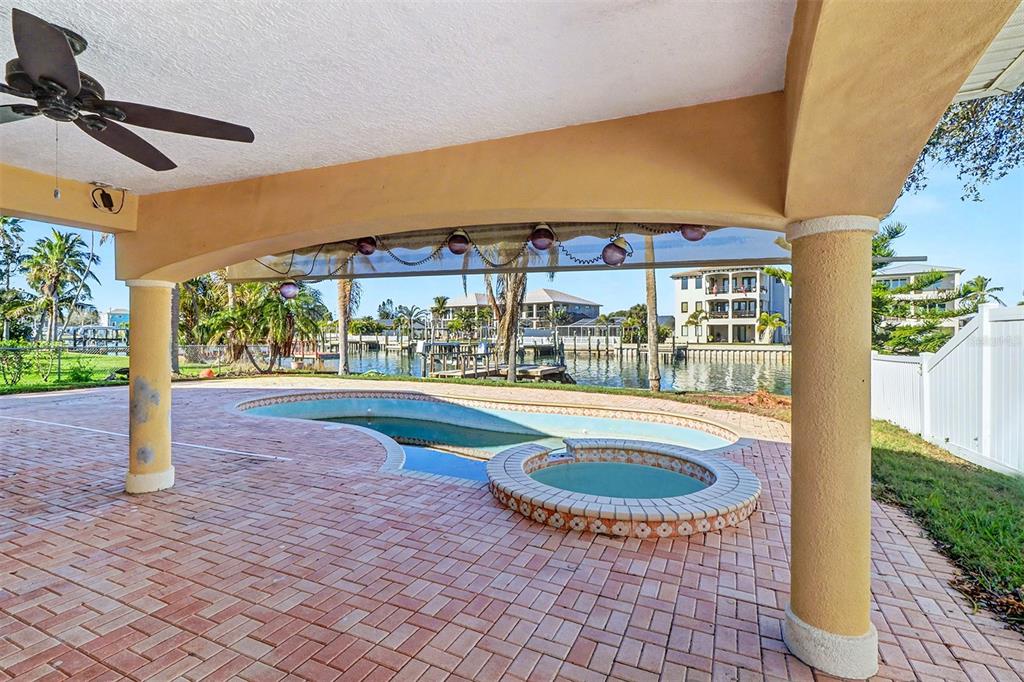 15918 Redington Drive Redington Beach, FL 33708 - Photo 21 of 33 a view of swimming pool with a patio and a yard
