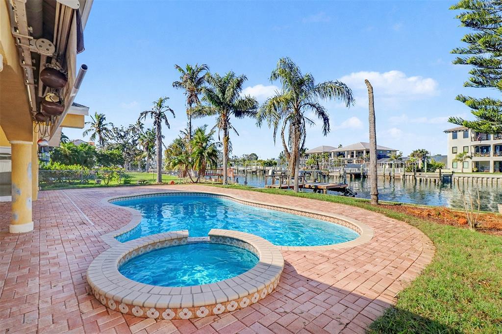 15918 Redington Drive Redington Beach, FL 33708 - Photo 22 of 33 a view of outdoor space yard swimming pool and patio