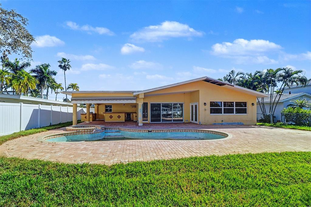 15918 Redington Drive Redington Beach, FL 33708 - Photo 27 of 33 a view of house with outdoor space and sitting area