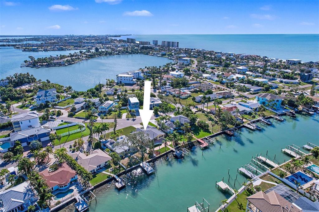15918 Redington Drive Redington Beach, FL 33708 - Photo 32 of 33 an aerial view of lake and residential houses with outdoor space