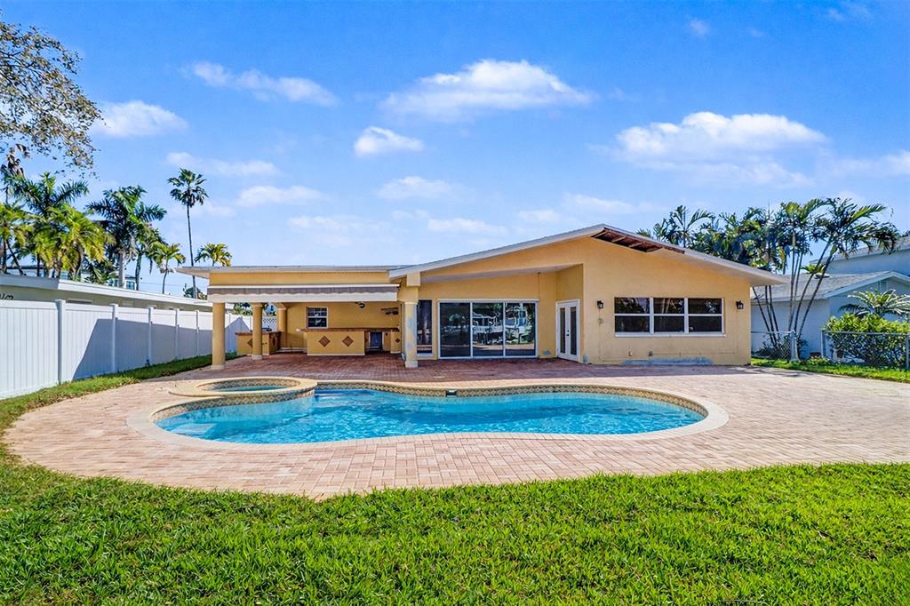 15918 Redington Drive Redington Beach, FL 33708 - Photo 5 of 33 a front view of a house with a yard