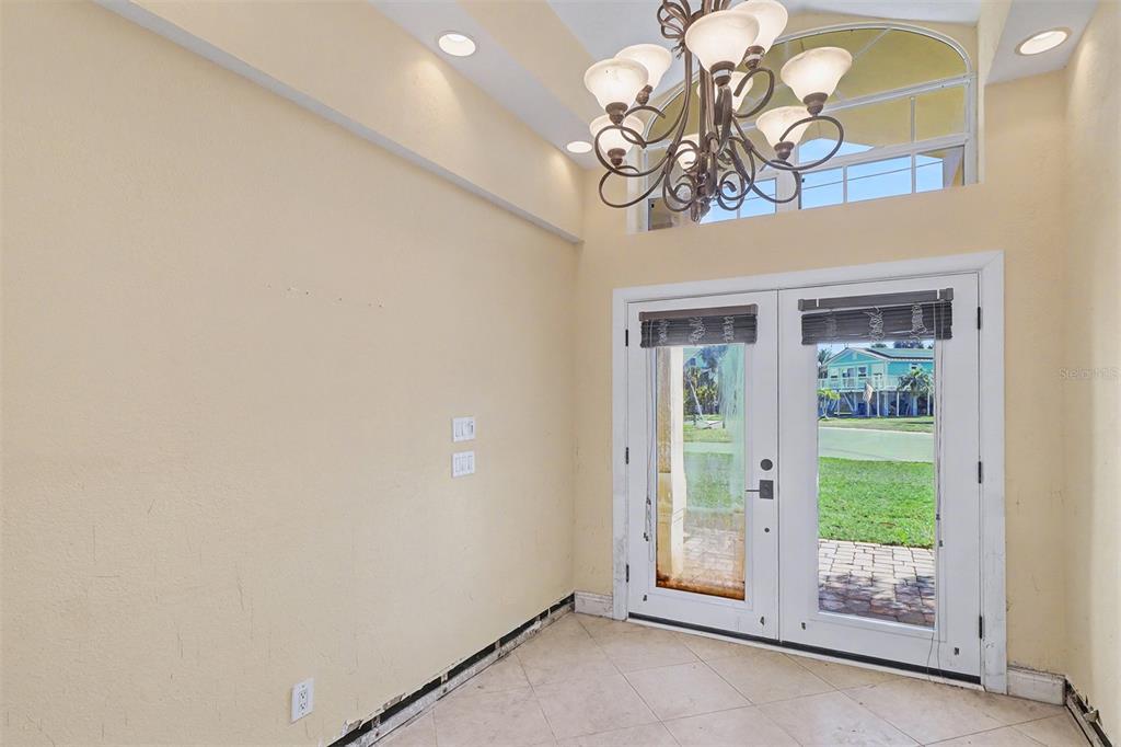 15918 Redington Drive Redington Beach, FL 33708 - Photo 6 of 33 a view of an empty room with a window