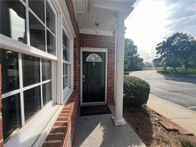 a view of a balcony with wooden floor