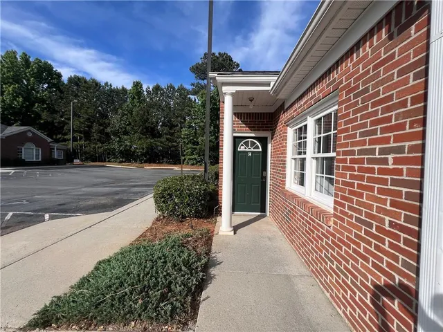 a view of a pathway both side of house