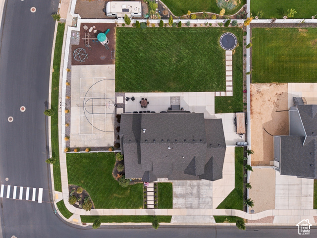 259 South Chamberlain Street Mapleton, UT 84664 - Photo 6 of 54 Expansive lot featuring a large lawn, dedicated sport court, concrete patio, and established landscaping