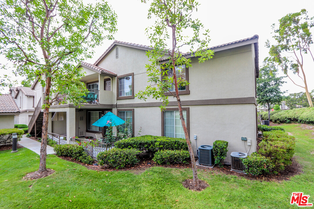 363 Chaumont Circle Foothill Ranch, CA 92610 - Photo 2 of 20 a front view of house with yard and green space