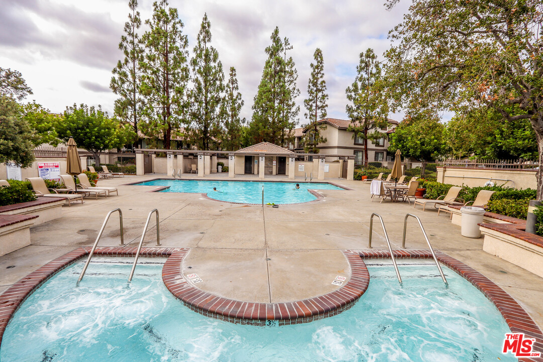 363 Chaumont Circle Foothill Ranch, CA 92610 - Photo 18 of 20 a view of a swimming pool with a patio