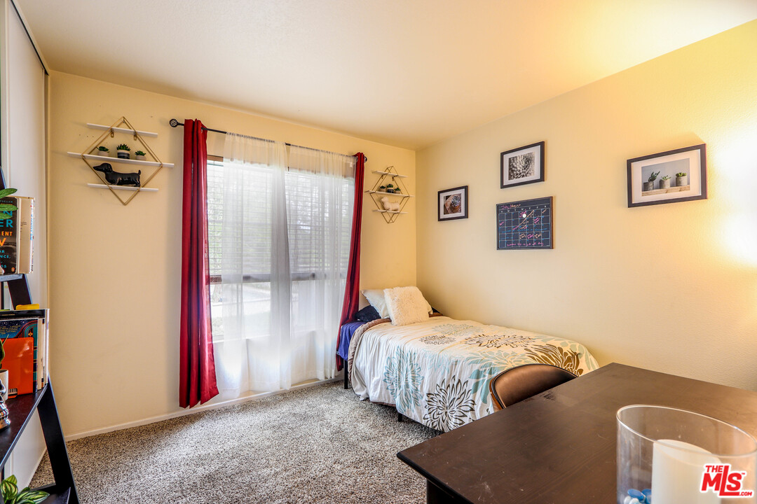 363 Chaumont Circle Foothill Ranch, CA 92610 - Photo 6 of 20 a bedroom with a bed and a chandelier