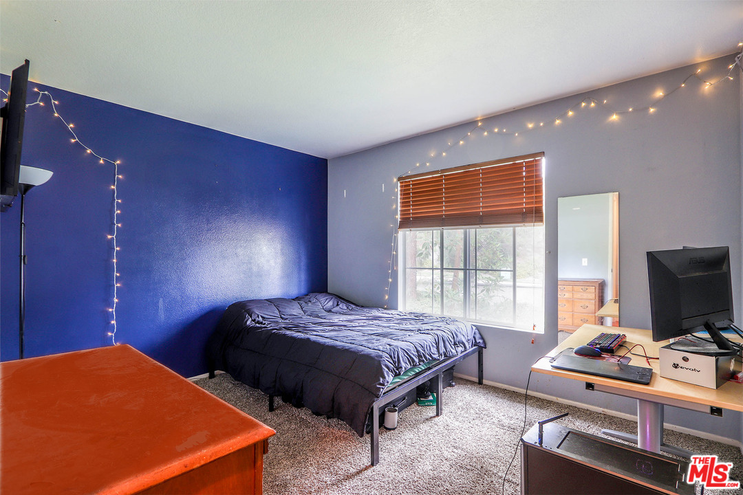 363 Chaumont Circle Foothill Ranch, CA 92610 - Photo 7 of 20 a bedroom with a bed and a flat screen tv
