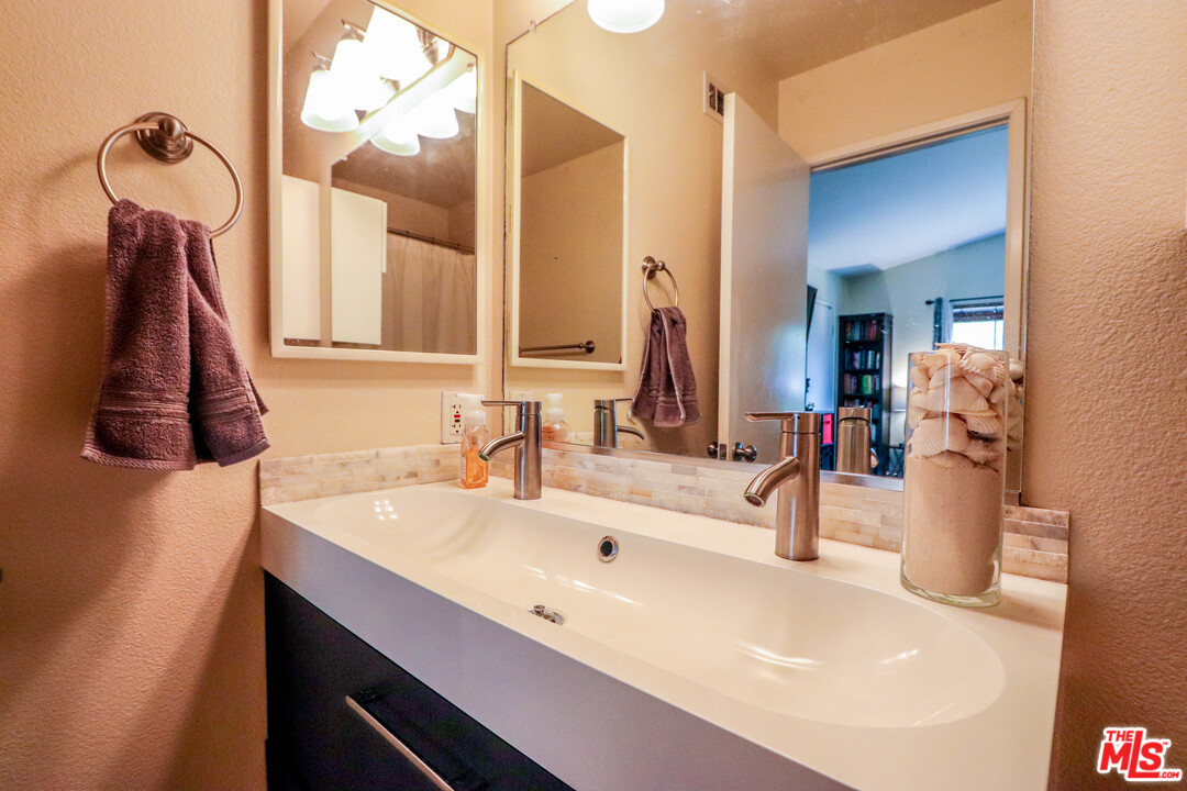 363 Chaumont Circle Foothill Ranch, CA 92610 - Photo 9 of 20 a bathroom with a sink and a mirror