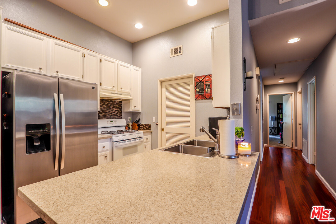 363 Chaumont Circle Foothill Ranch, CA 92610 - Photo 10 of 20 a kitchen with stainless steel appliances a refrigerator sink and stove