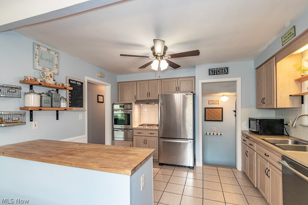 1140 Elmwood Road Cleveland, OH 44124 - Photo 5 of 29 Charming kitchen with ease of movement, lots of storage, and large countertop for prepping and entertaining.
