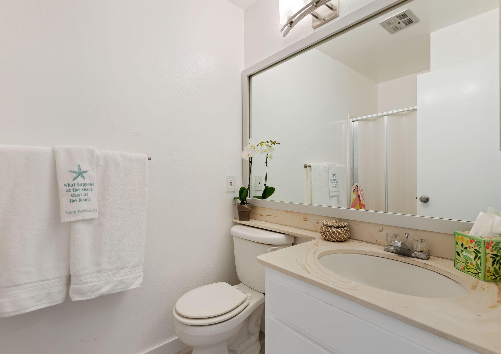4700 Sandyland Road, Unit 35 Carpinteria, CA 93013 - Photo 13 of 38 a bathroom with a granite countertop sink mirror vanity and toilet