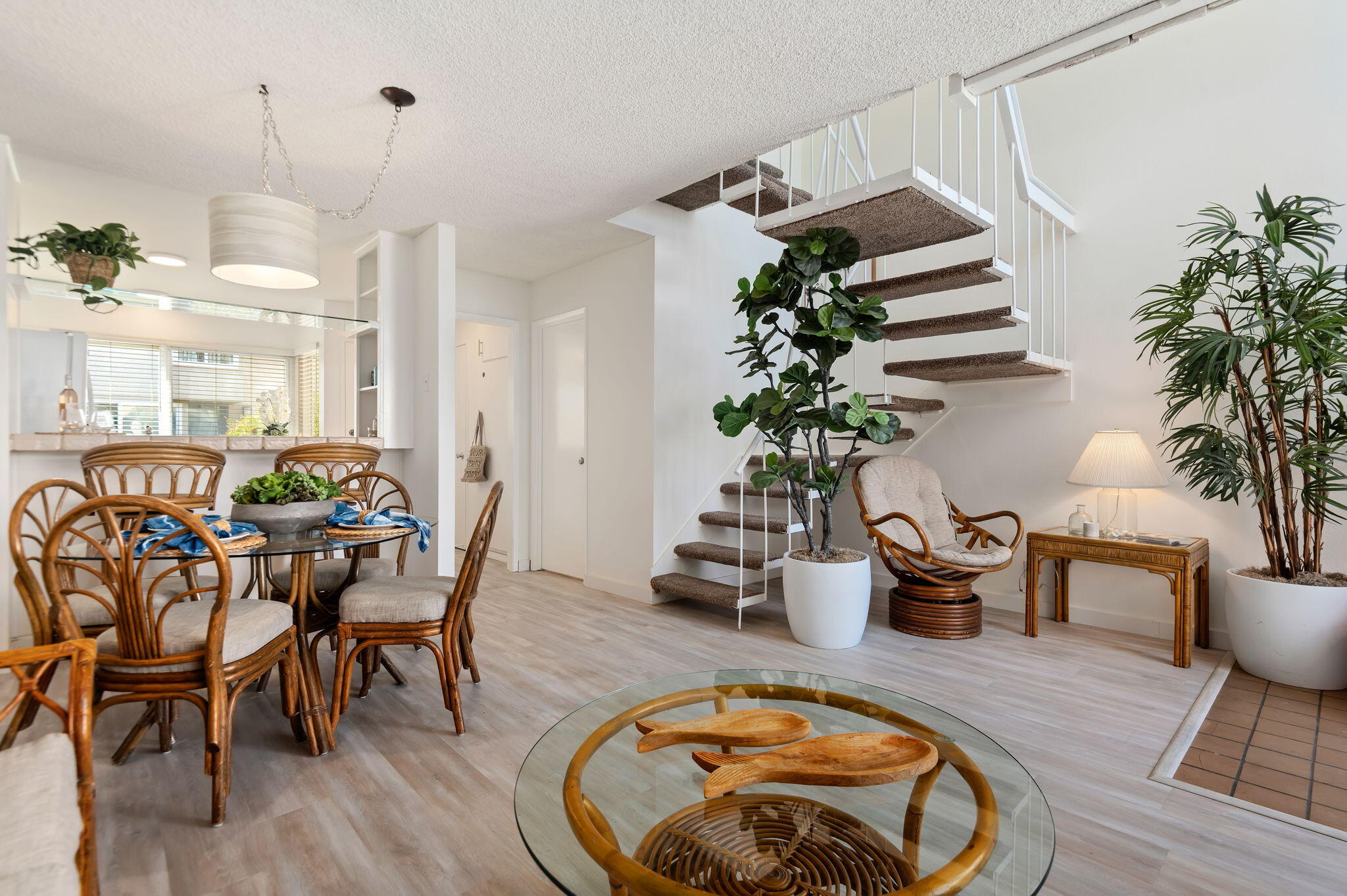4700 Sandyland Road, Unit 35 Carpinteria, CA 93013 - Photo 6 of 38 a dining room with furniture potted plants and wooden floor
