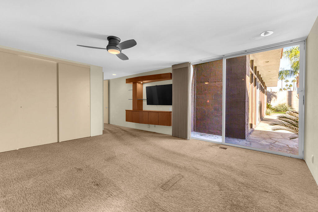 1421 Tamarisk W Street, Unit 3 Rancho Mirage, CA 92270 - Photo 21 of 65 an empty room with windows and entryway