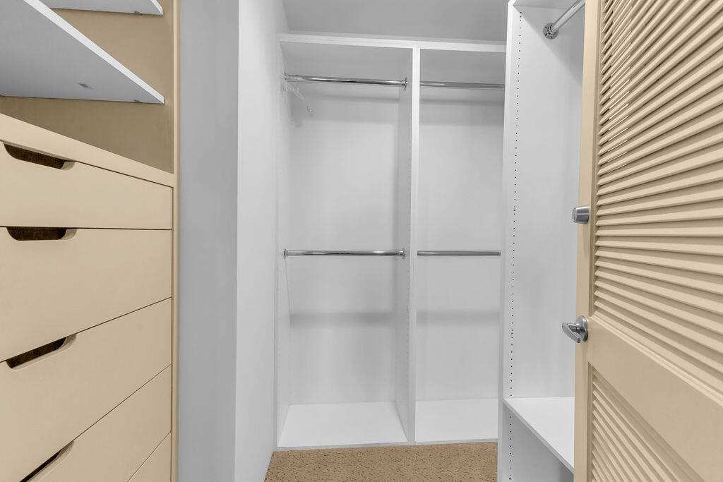 1421 Tamarisk W Street, Unit 3 Rancho Mirage, CA 92270 - Photo 36 of 65 a bathroom with a glass shower door