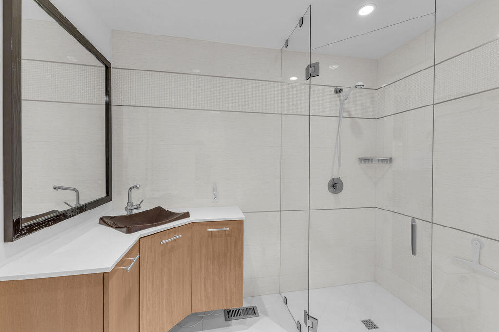 1421 Tamarisk W Street, Unit 3 Rancho Mirage, CA 92270 - Photo 37 of 65 a bathroom with a sink and a shower