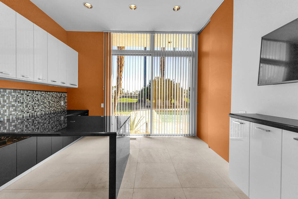 1421 Tamarisk W Street, Unit 3 Rancho Mirage, CA 92270 - Photo 43 of 65 a view of a hallway and a livingroom with furniture