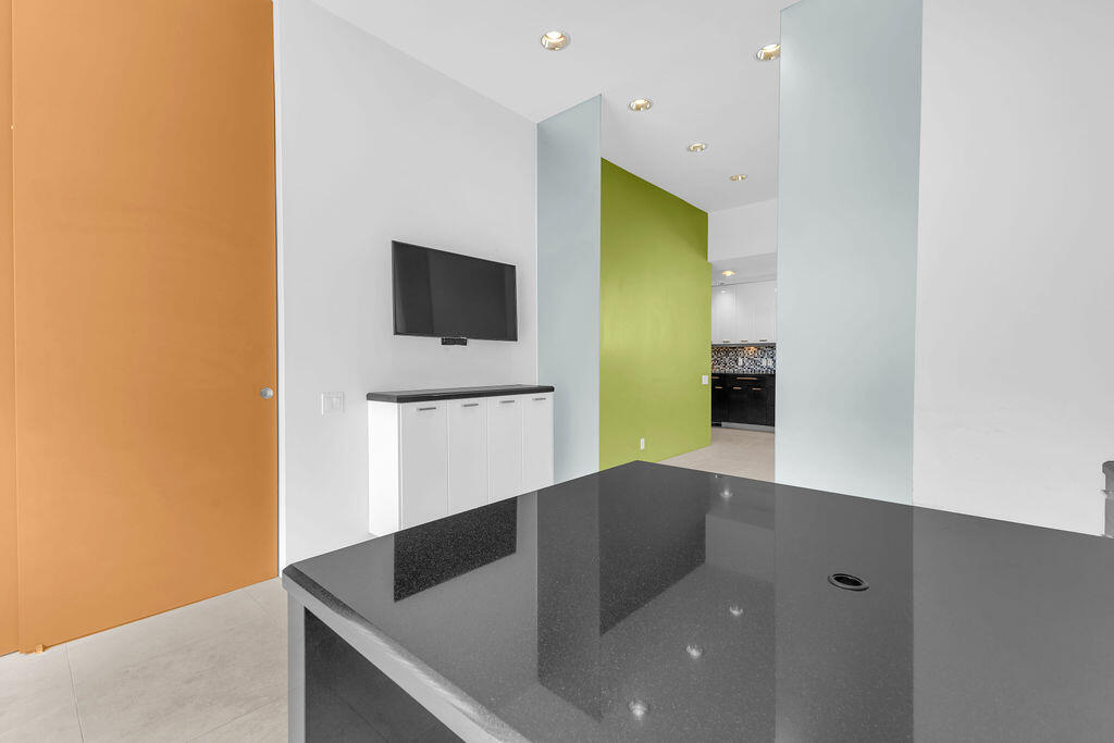 1421 Tamarisk W Street, Unit 3 Rancho Mirage, CA 92270 - Photo 45 of 65 a view of a living room with flat screen tv