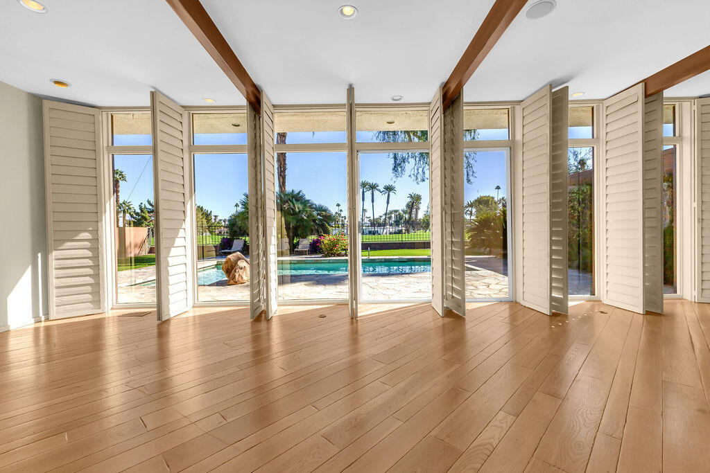 1421 Tamarisk W Street, Unit 3 Rancho Mirage, CA 92270 - Photo 46 of 65 a view of an entryway with wooden floor