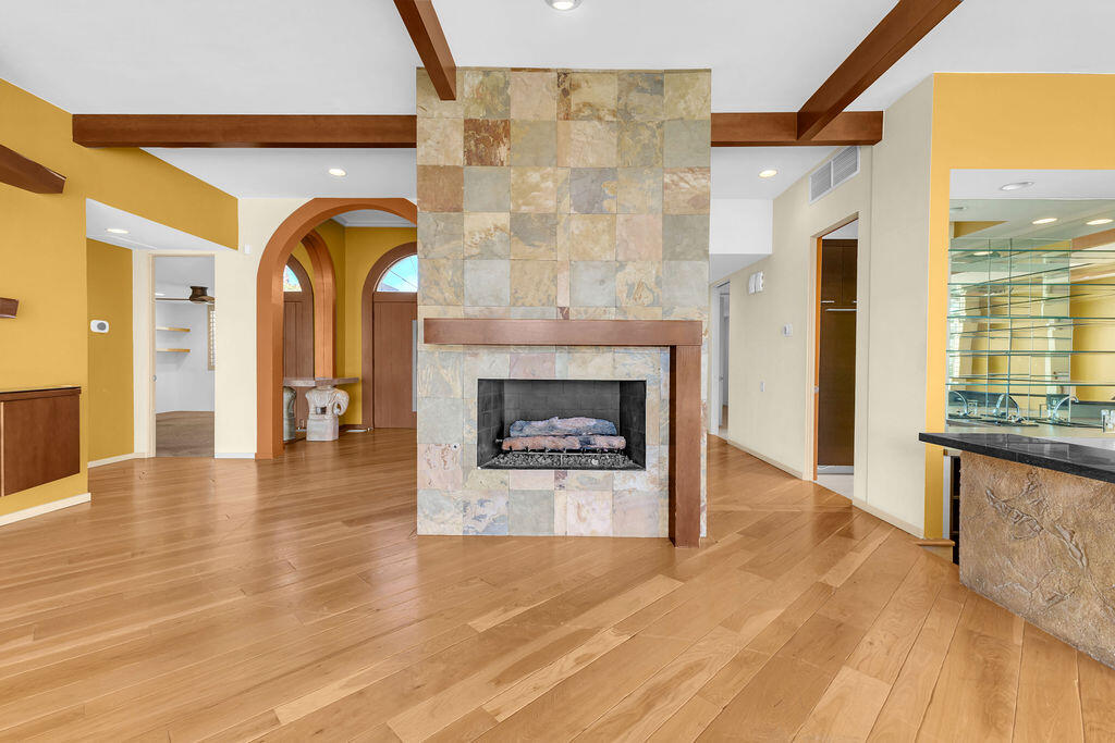 1421 Tamarisk W Street, Unit 3 Rancho Mirage, CA 92270 - Photo 9 of 65 a view of an entryway with a fireplace
