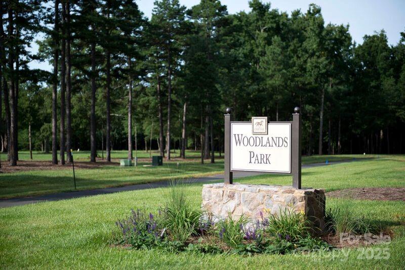 6223 Hollow Oak Drive, Unit 87 Mint Hill, NC 28227 - Photo 7 of 16 a view of a park with welcome board