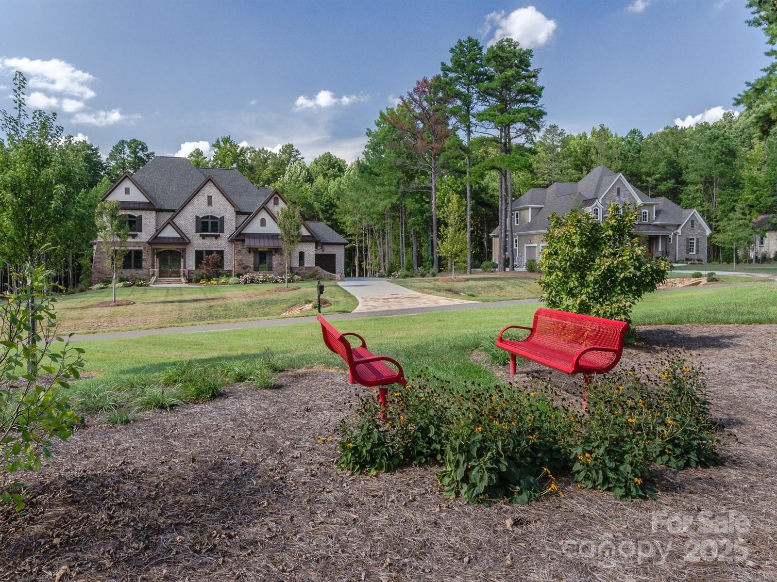 6223 Hollow Oak Drive, Unit 87 Mint Hill, NC 28227 - Photo 8 of 16 a view of a house with backyard and a garden