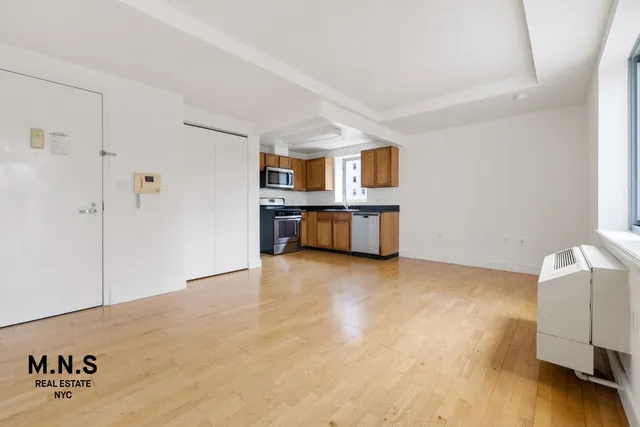 a view of a storage & utility room with a window