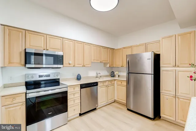 a view of wooden floor and windows in a room