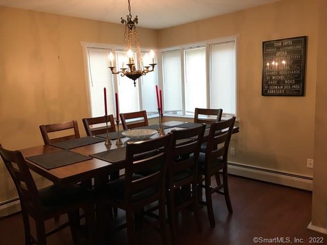 a view of a dining room with furniture and window