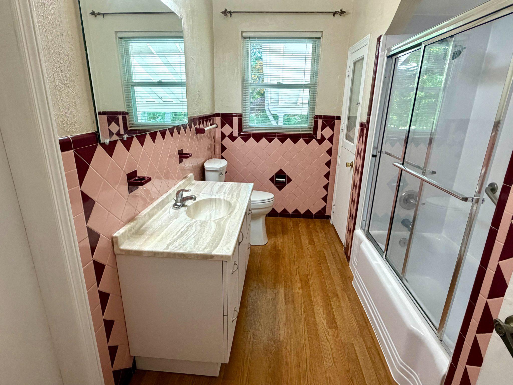 6318 Winner Avenue Baltimore, MD 21215 - Photo 32 of 75 a bathroom with a tub sink and mirror