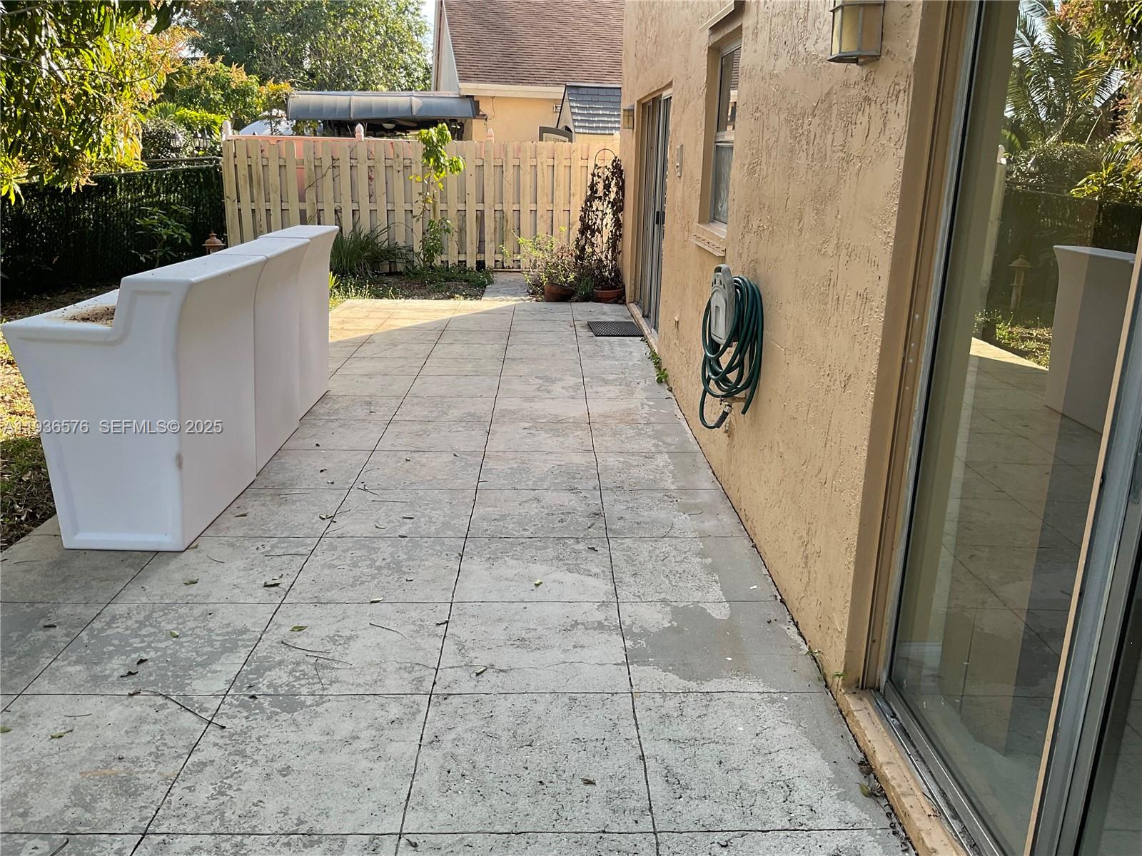 3161 Venice Way Miramar, FL 33025 - Photo 33 of 37 a view of a pathway with a wrought fence