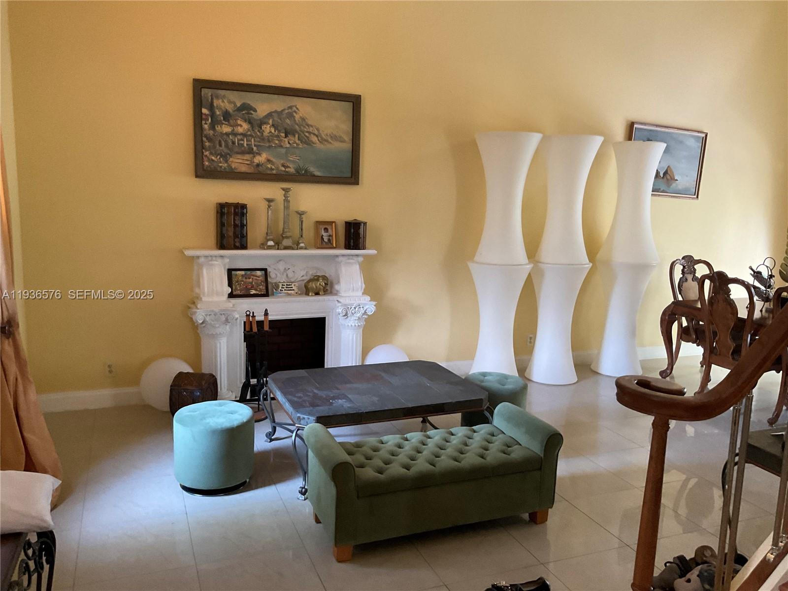 3161 Venice Way Miramar, FL 33025 - Photo 4 of 37 a living room with furniture and a fireplace