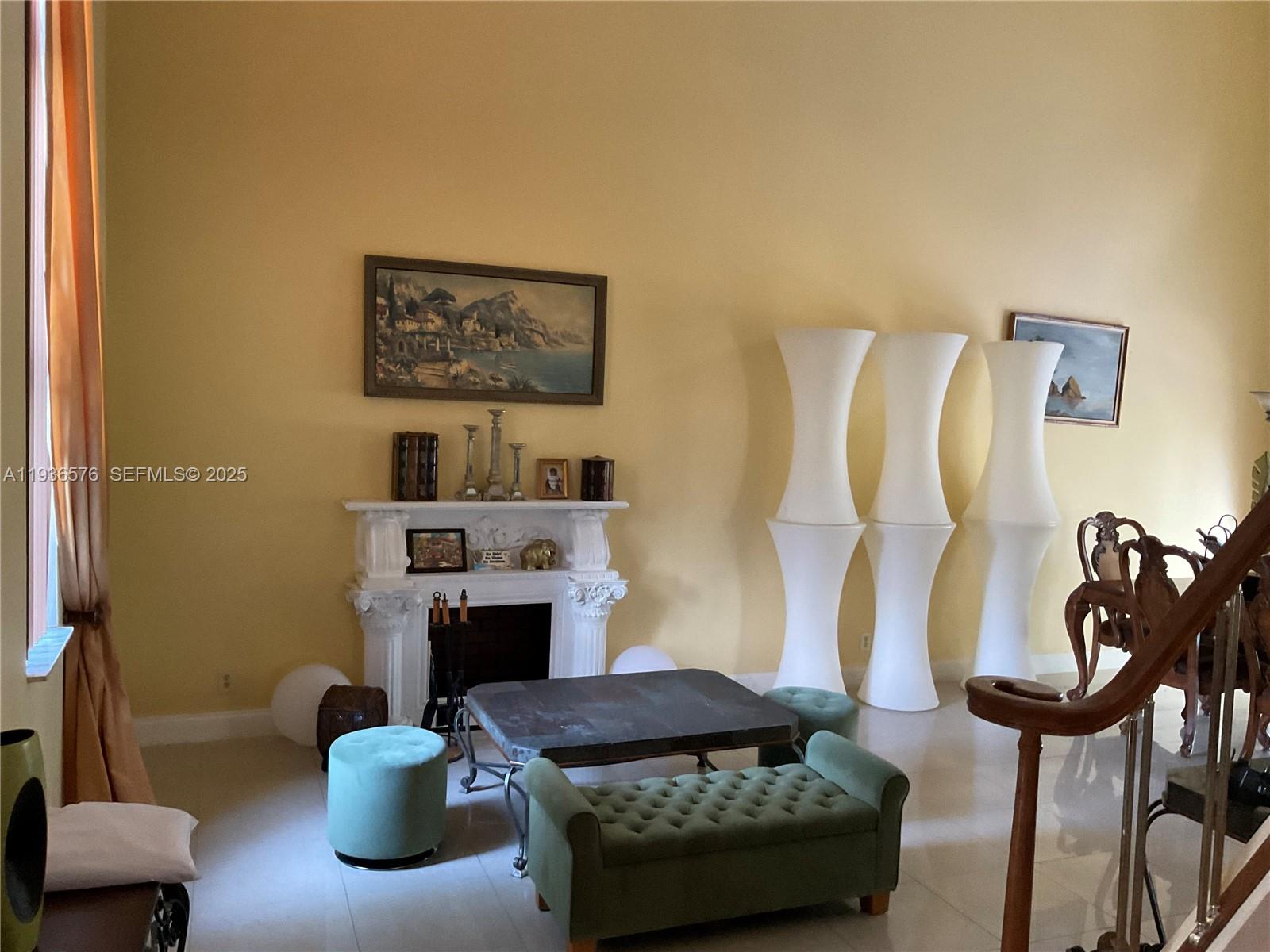 3161 Venice Way Miramar, FL 33025 - Photo 5 of 37 a living room with furniture and a fireplace