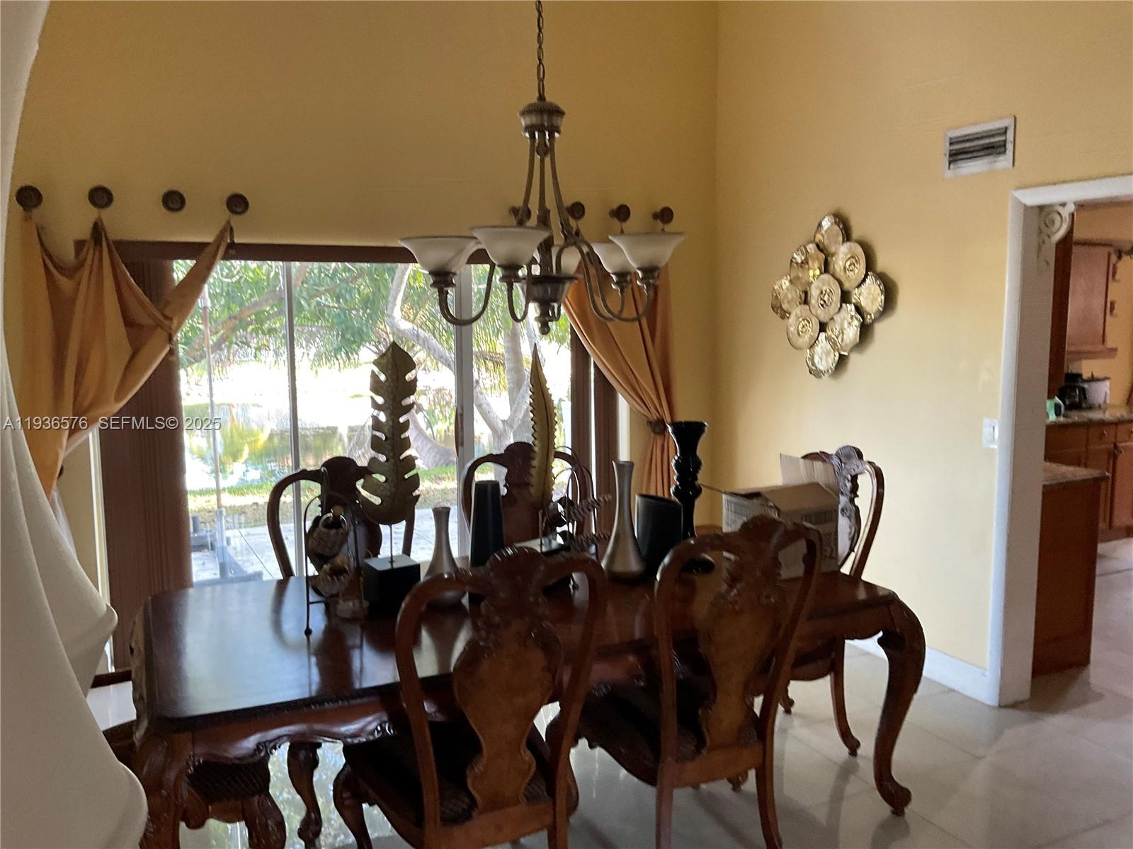 3161 Venice Way Miramar, FL 33025 - Photo 8 of 37 a view of a dining room with furniture window and outside view