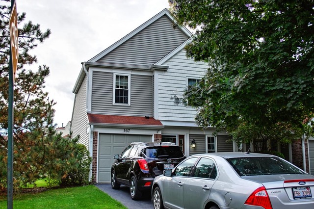 167 North Oltendorf Road Streamwood, IL 60107 - Photo 1 of 15 a view of a car park in front of house