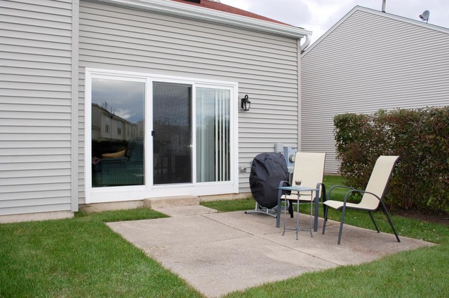 167 North Oltendorf Road Streamwood, IL 60107 - Photo 14 of 15 a view of a chair and table in backyard of the house