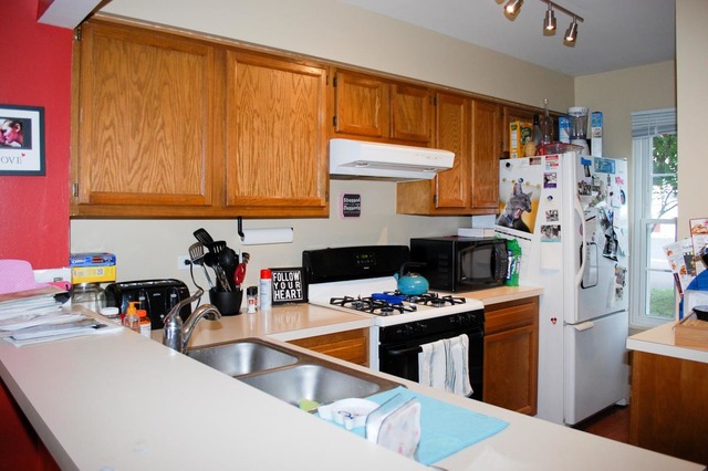 167 North Oltendorf Road Streamwood, IL 60107 - Photo 5 of 15 a kitchen with stainless steel appliances a sink a stove and a refrigerator