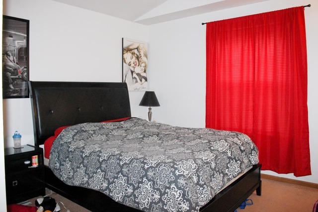 167 North Oltendorf Road Streamwood, IL 60107 - Photo 7 of 15 a bedroom with a bed and window