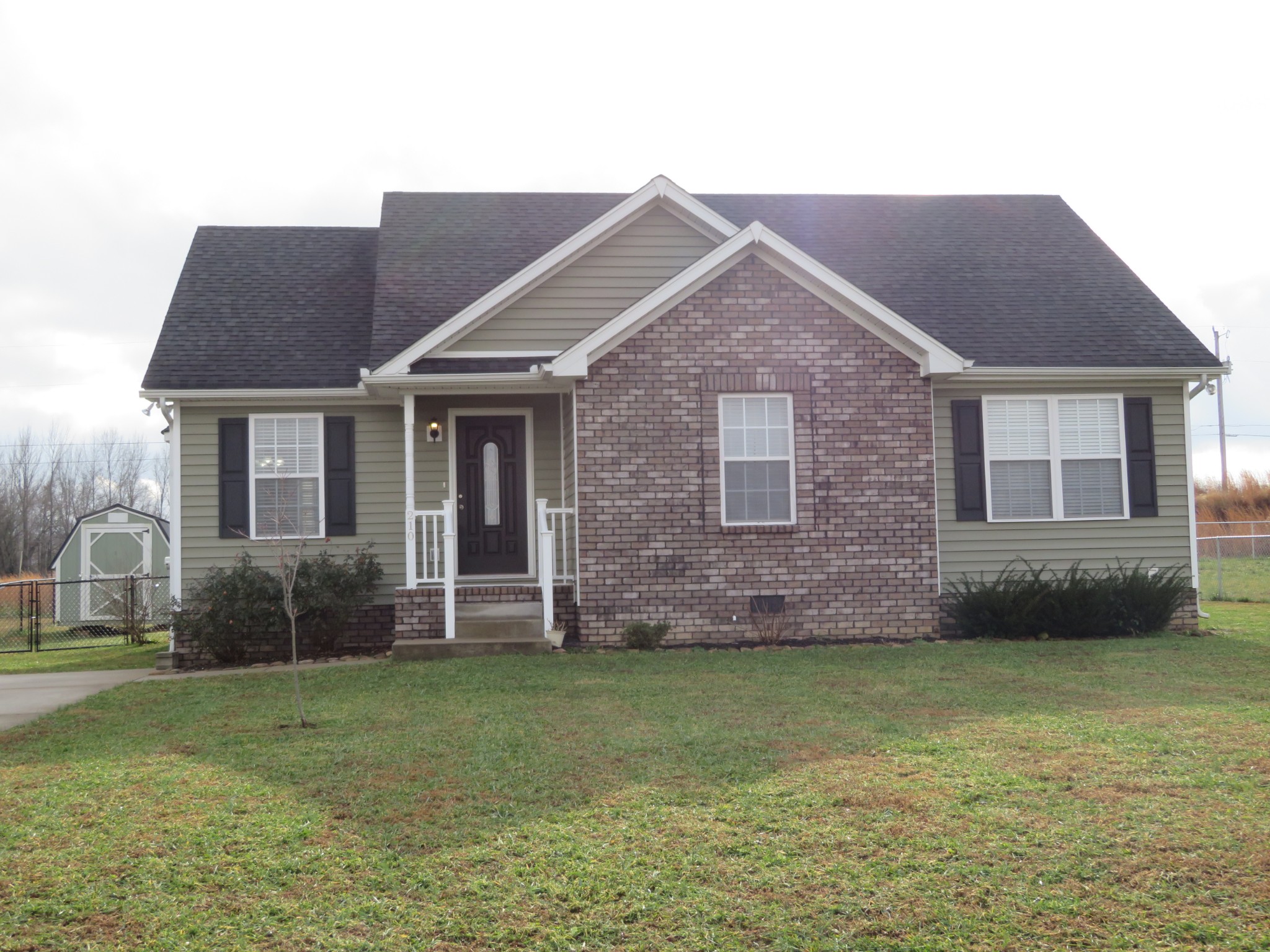 210 Shaub Road Portland, TN 37148 - Photo 1 of 22 a front view of a house with a garden