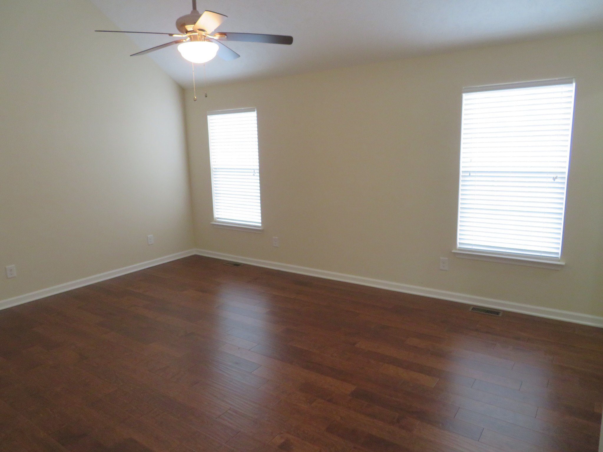 210 Shaub Road Portland, TN 37148 - Photo 15 of 22 a view of an empty room with wooden floor and a window