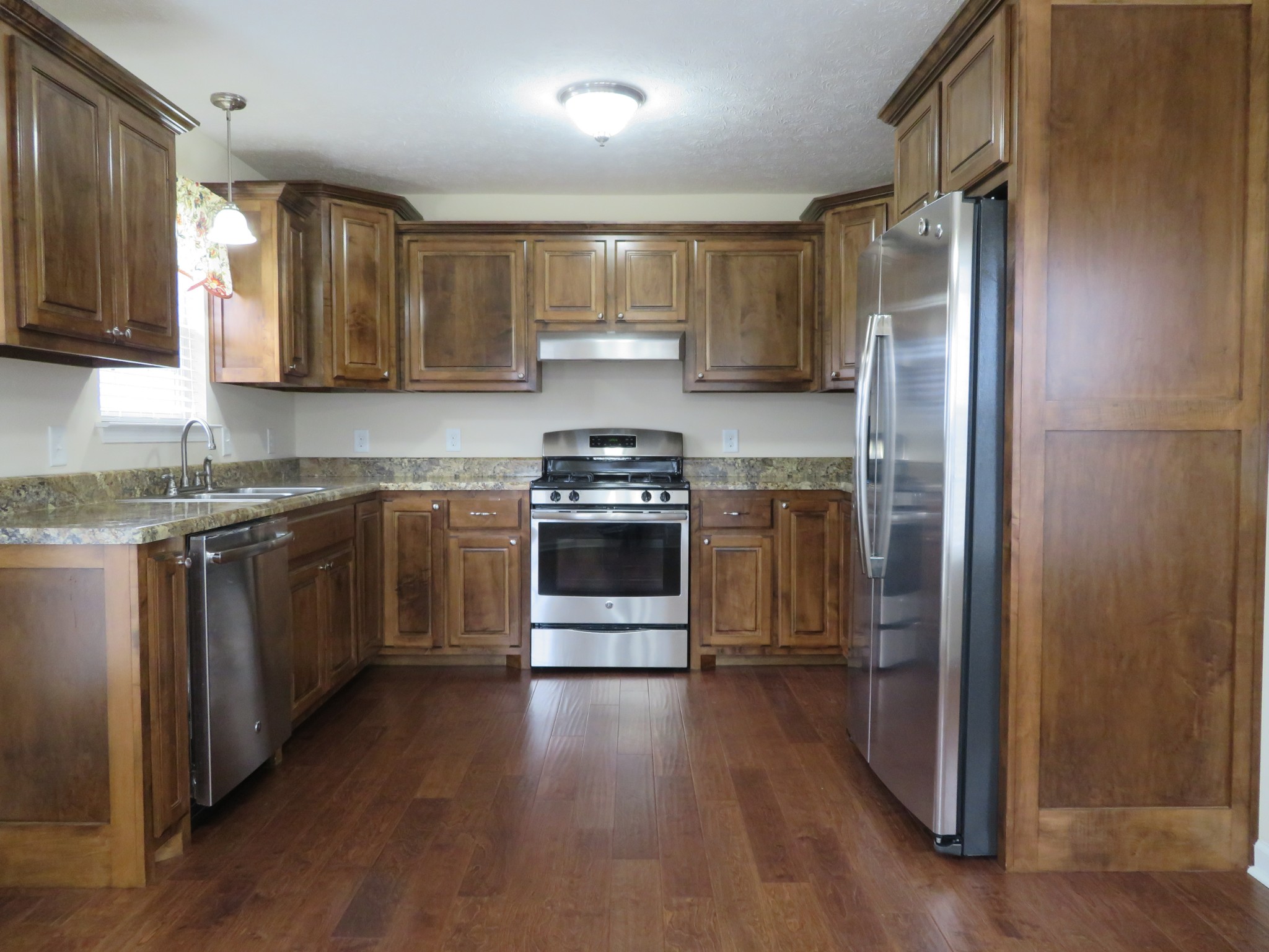 210 Shaub Road Portland, TN 37148 - Photo 8 of 22 a kitchen with stainless steel appliances a stove a sink and a refrigerator